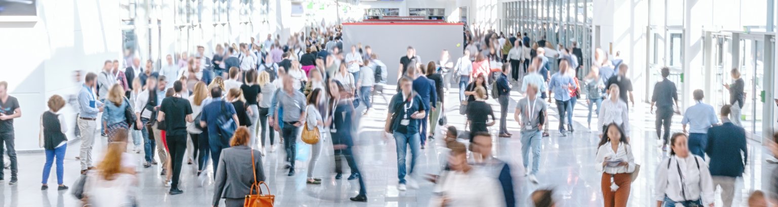 blurred business people at a trade fair