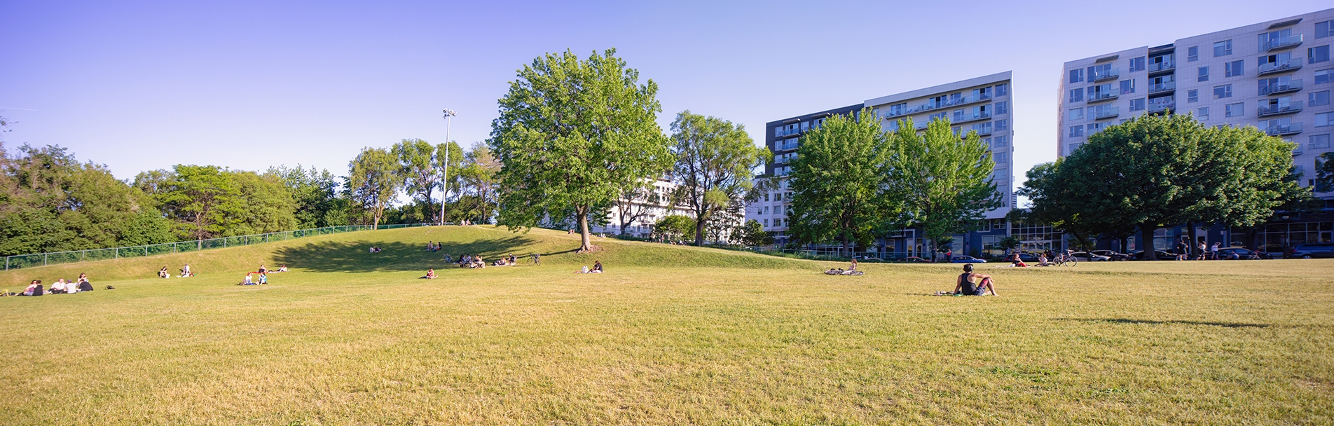 Montreal Rosemont public park with a small crowd of people respecting social distancing Montreal Rosemont public park with a small crowd of people respecting social distancing